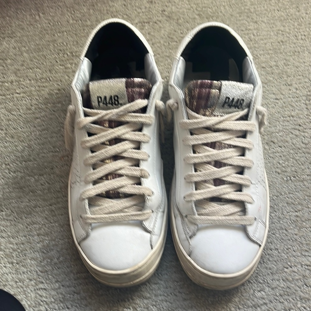 P448 sneakers with a metallic purple and gold tongue